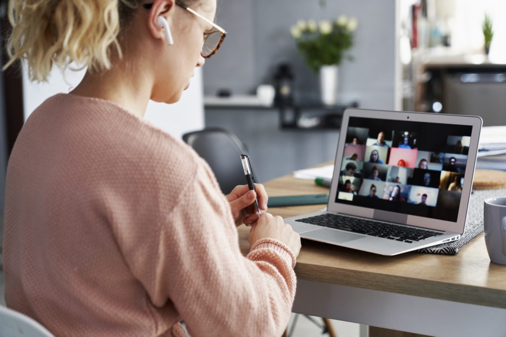 Young teacher teaching video conference e-learning to elementary school student